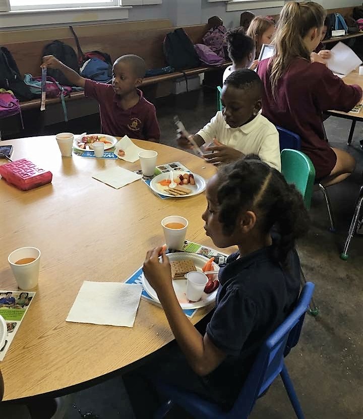 Students eating at a table.