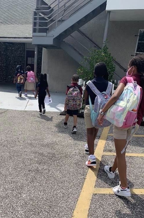 Students entering school.