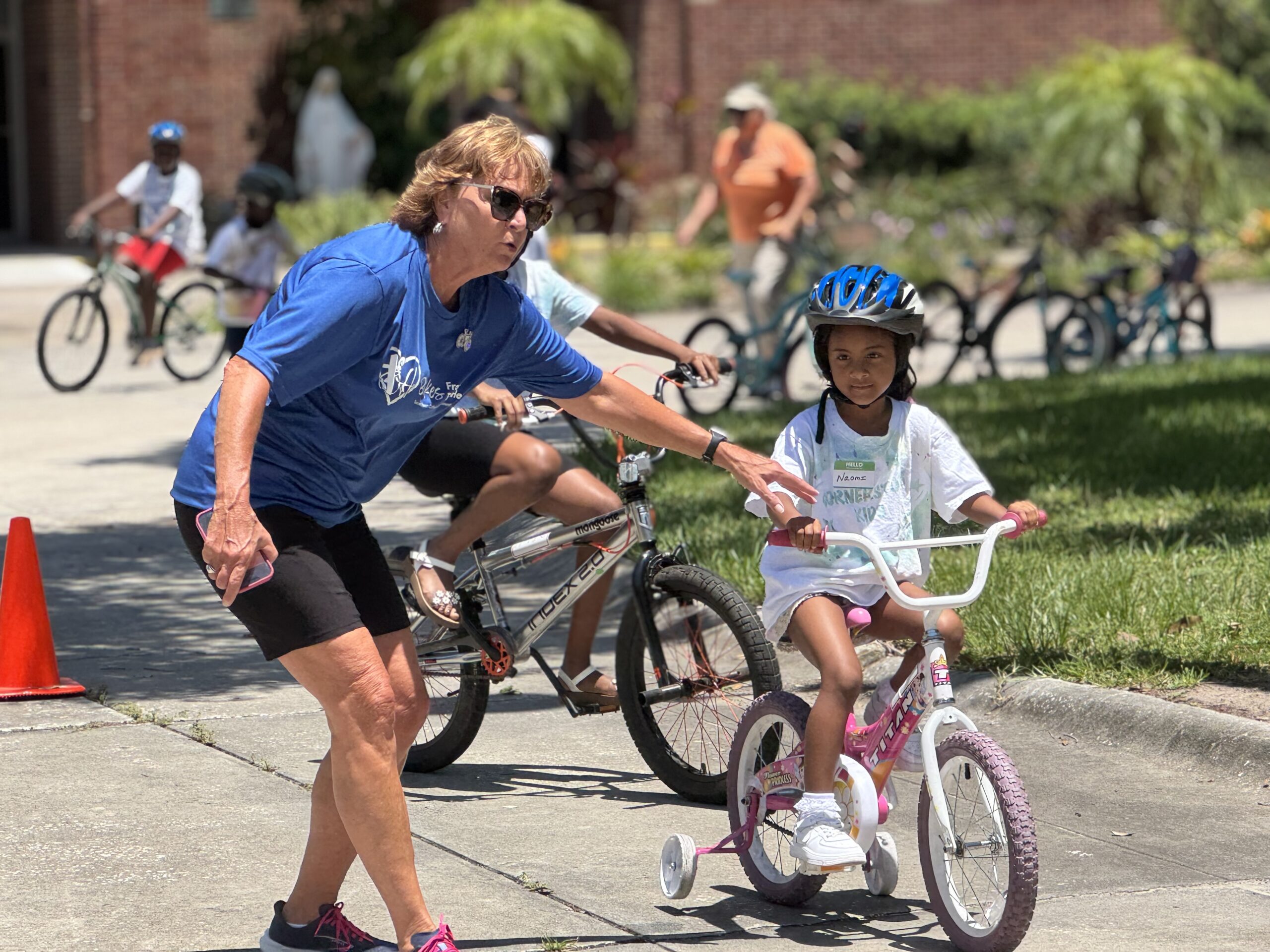 Volunteer helps balance a student